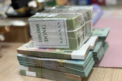 Credit growth has been on the upward trend following a fall in July. (Photo: VietnamPlus)