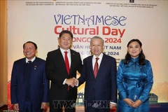General Secretary of the Communist Party of Vietnam Central Committee and State President To Lam (second from right) at the Vietnamese Cultural Day (Photo: VNA)