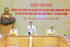 Prime Minister Pham Minh Chinh chairs a meeting between Cabinet members and leaders of joint stock commercial banks to seek measures to promote national socio-economic development on September 21 (Photo: VNA)