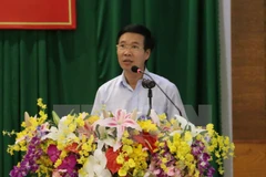Vietnam, Laos Parties share experience in sustainable development 