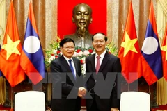 President: Vietnam gives top priority to boosting ties with Laos