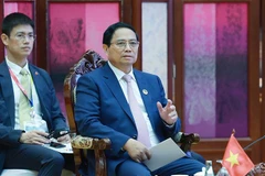 Prime Minister Pham Minh Chinh speaks at an October 9 retreat session with leaders of member states and Timor-Leste in in Vientiane, Laos, as part of the 44th and 45th ASEAN Summits and related summits. (Photo: VNA)