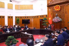At the meeting in Hanoi on August 12 (Photo: VNA)