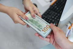 Reference exchange rate down 2 VND