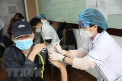Minister urges faster progress of third dose vaccination