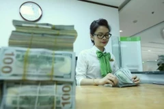 Reference exchange rate down 7 VND at week’s beginning 