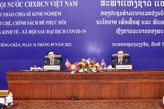 Vietnamese, Lao NAs share experience in designing post-pandemic socio-economic recovery policies