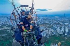 Admiring Ho Chi Minh City while paragliding