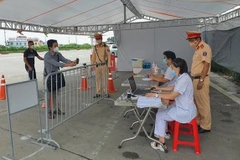 COVID-19: Hanoi installs cameras for QR code scanning at 67 checkpoints