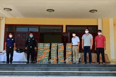 Gifts presented to poor Vietnamese in Cambodia 
