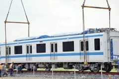 Train carriages of HCM City’s first metro line installed onto trial track
