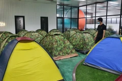 Firms strive to maintain production amid lockdown in HCM City