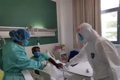 Face masks presented to Vietnamese community in Laos
