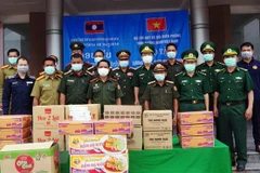 Food, medical supplies presented to border forces in Lao province