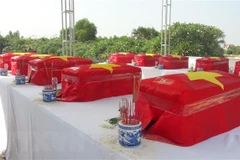 Remains of martyrs repatriated from Laos, reburied in Ha Tinh, Quang Binh