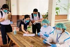 Laos’s daily COVID-19 cases exceed 1,000 