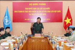 Sen. Lieut. Gen. Hoang Xuan Chien (standing), member of the Party Central Committee, Deputy Minister of National Defence addresses the ceremony (Photo: VNA)