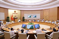 At the meeting (Photo: VNA)