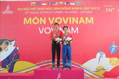 Two silver medalists of Vietnam at the 48-53.9kg sparring and men’s Five Gate Form performance events. (Photo: VNA)