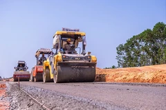 Contractors construct a section of a North-South Expressway project in the 2021-2025 period. (Photo: VietnamPlus)