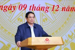 Prime Minister Pham Minh Chinh, who is also Chairman of the Central Emulation and Commendation Council, chairs its 10th meeting Hanoi on December 9. (Photo: VNA)