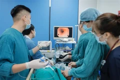 Doctors conduct surgery at Endoscopy Department of Bach Mai Hospital in Hanoi. (Photo: VNA)