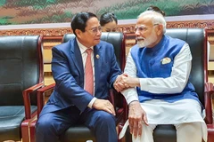 Vietnamese Prime Minister Pham Minh Chinh (L) and Indian counterpart Narendra Modi (Photo: baochinhphu.vn)