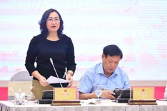 Deputy Minister of Industry and Trade Phan Thi Thang speaks at the meeting. (Photo: VietnamPlus)