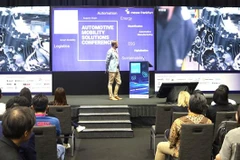 An overview of a conference held at the event (Photo: VNA)