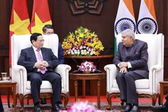 Prime Minister Pham Minh Chinh meets Vice President and Chairman of the Indian Upper House (Rajya Sabha) Jagdeep Dhankhar in New Delhi on August 1. (Photo: VNA)