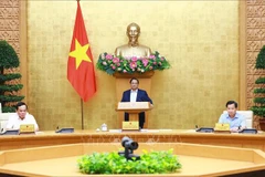 PM Pham Minh Chinh chairs the Government’s law-building meeting on June 13. (Photo: VNA)