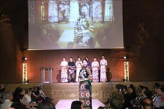 Ao dai designs by Lan Huong are showcased at the diplomatic multicultural fundraising event in London on May 11. (Photo: VNA)