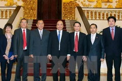 PM asks Vietnamese, Lao news agencies to foster links 