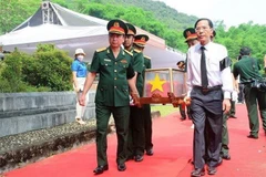Reburial held in Thanh Hoa for remains of martyrs repatriated from Laos