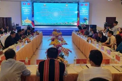 Vietnam, Laos boost front work cooperation among localities