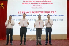 At the signing ceremony (Photo: VNA)