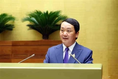 Minister-Chairman of the Government Committee for Ethnic Minority Affairs Hau A Lenh delivers the Government's proposal on adjustments to the investment policy for the national target programme on boosting the socio-economic development of ethnic minority-inhabited and mountainous areas in the 2021-2030 period at the 15th National Assembly's 7th session on May 22. (Photo: VNA)