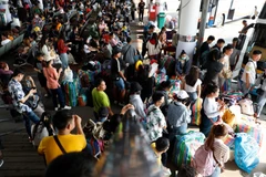 Holidaymakers wait to take buses to their hometowns during the Songkran long holiday in April this year, at Mo Chit bus terminal in Bangkok. (Photo: Bangkok Posts) 