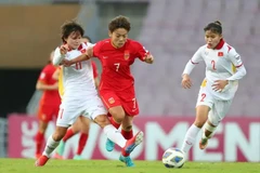 The Vietnamese women's football team in a friendly with the Chinese women's football team in China in October 2024 (Photo: VNA)