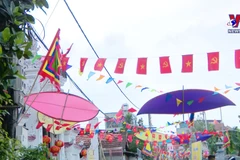 Colourful kites fly high over Hanoi village