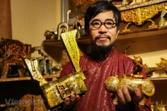 Artist welcomes New Year with feline statuettes