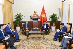 Deputy Prime Minister and Minister of Foreign Affairs Bui Thanh Son (R) on December 6 receives Azerbaijani Ambassador to Vietnam Shovgi Kamal Oglu Mehdizade. (Photo: baochinhphu.vn)