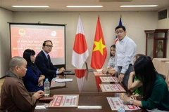 Representatives from Vietnamese Embassy and associations in Japan at the meeting to review the donation campaign to support typhoon victims. (Photo: VNA)