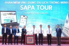 Representatives from agencies are at the launching ceremony of the app "Sapa Tour" to promote tourism in resort town of Sa Pa in northern province of Lao Cai. (Photo: nhandan.vn)