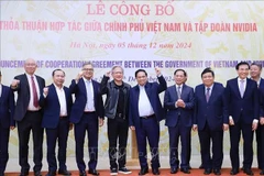 Prime Minister Pham Minh Chinh (fourth, from right), and President and CEO of NVIDIA Jensen Huang at the ceremony to announce the cooperation agreement between the Government of Vietnam and the US chip giant. (Photo: VNA)