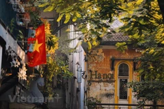 Contemplating nostalgic street corners of Hanoi 