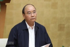 Prime Minister Nguyen Xuan Phuc chairs a meeting between the Government’s permanent members and the National Steering Committee for COVID-19 Prevention and Control (Photo: VNA)