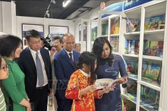 Deputy Minister of Foreign Affairs Le Thi Thu Hang, who is also Chairwoman of the State Committee for Overseas Vietnamese Affairs (COVA), attends the inauguration ceremony for the “Vietnamese bookcase” in Paris. (Photo: VNA)
