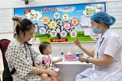 Providing Vitamin A doses to children in Hanoi (Photo: VNA)