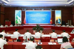 At the meeting (Photo: VNA)